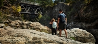 A couple hiking at Cascade Falls near Christina Lake | Hubert Kang